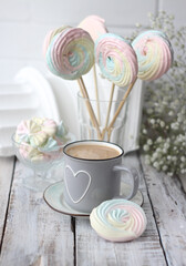 cup of coffee and cookies on wooden table
