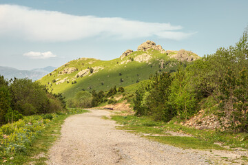 Old moody dirt village road leading to the Pushkin pass in the mountains of Armenia.