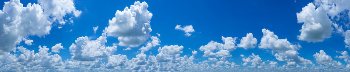 Naklejka na ściany i meble panoramic blue sky background with many clouds