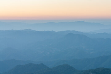 Fototapeta na wymiar Overlapping mountains landscape at the sunset