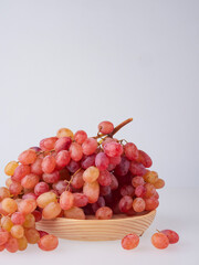 red seedless grapes isolated on white background