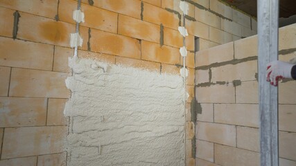 Repair of the premises. Restoration of design in a new apartment. Partially plastered wall.