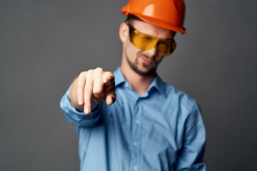 man in construction uniform blue shirt gesture hands emotions work