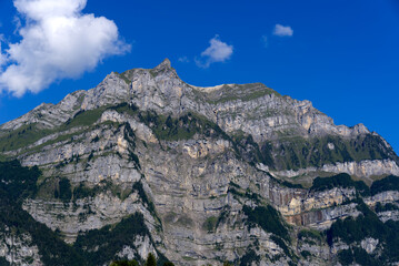 Fototapeta premium Mountain seen from at City of Glarus on a sunny late summer day. Photo taken September 4th, 2021, Glarus.