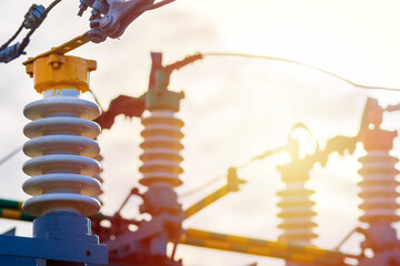 High voltage circuit electric breaker in a power substation.Closeup of high voltage insulators at...
