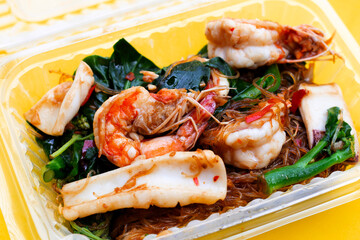 Spicy stir fried vermicelli with holy basil leaves and sea food