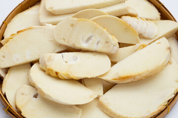 Bamboo shoots in bamboo basket on white background