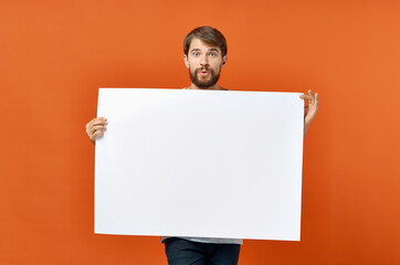 funny man holding a mockup poster discount orange background