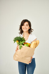 woman with package of groceries delivery service
