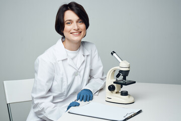 woman scientist laboratory microscope biotechnology