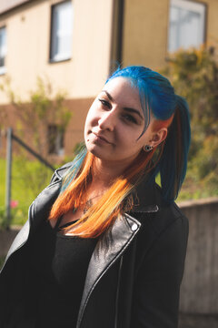 portrait of a girl with colorful hair on the street