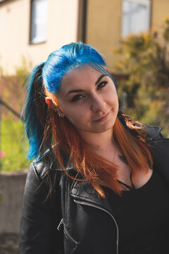 portrait of a girl with colorful hair on the street