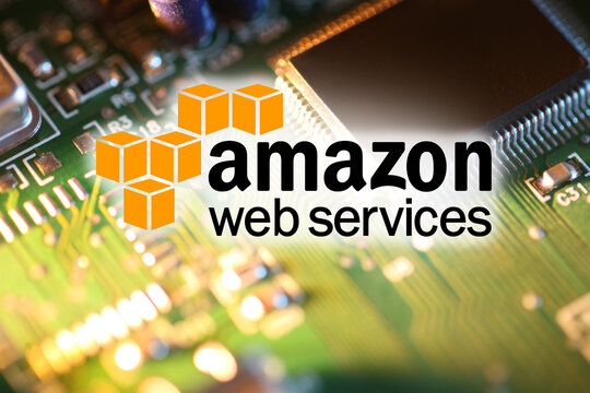Amazon Web Services logo over processor chip on circuit board