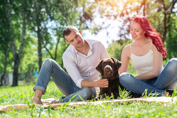 Couple with a dog in the park