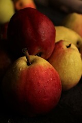 sweet and fragrant autumn pears on rustic black wooden table