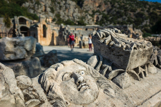 Face stone carving in ancient town of Myra in Lycia region, Antique culture archaelogical site, Ruins of ancient city of Myra in Demre, Turkey