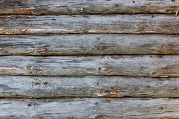 Log cabin or shed unpainted debarked wall textured. Horizontal background.