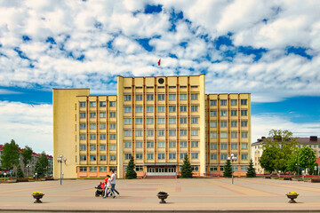 Slutsk, BELARUS - September 17, 2021: administrative building on the square happy family with...