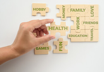 Embedding the Health puzzle piece in the puzzle of life. Life concept, balance.