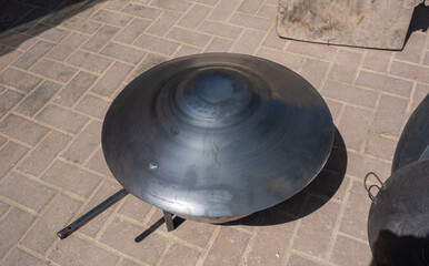 Traditional eastern concave disc-shaped frying pan - tava, tawa, tapa, saj, or saj tava