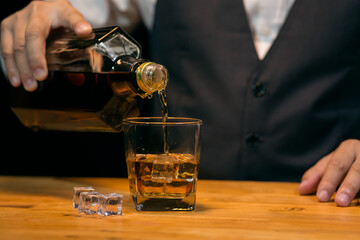 Barman pouring whiskey whiskey glass beautiful night