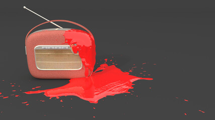 old radio covered with red paint in the form of a blot
