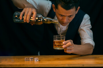 Barman pouring whiskey whiskey glass beautiful night