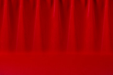 Luxury classic theatre abstract scene with saturated scarlet red silk curtain with smooth creases....