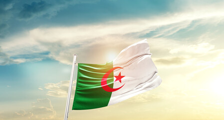 Algeria national flag cloth fabric waving on beautiful sky - Image - obrazy, fototapety, plakaty