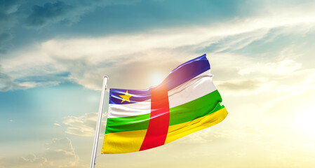 Central African Republic national flag cloth fabric waving on beautiful sky - Image