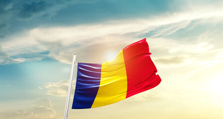 Chad national flag cloth fabric waving on beautiful sky - Image
