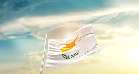 Cyprus national flag cloth fabric waving on beautiful sky - Image