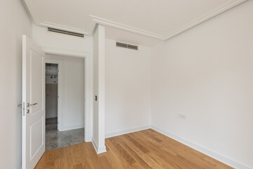 White walls, wooden floor, empty apartment interior