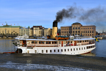 Shot of a white ship emitting black smoke in the National Museum in Stockholm, Sweden