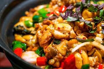 A pot of delicious green pepper and basil dry pot bullfrog