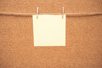 Note paper swith push pins on cork board. Empty paper pages for notes copy space for text. Cork...