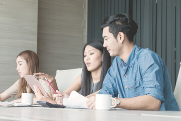 Businessman and team having meeting at meeting room in office.
