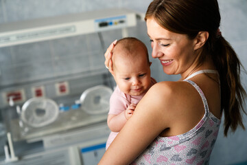 Baby and mother in hospital. New life concept.