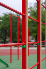 Fototapeta na wymiar Sports ground with a variety of horizontal bars. Open area for sports in the city park. Horizontal and vertical bars. Sports, active lifestyles. No people. Selective focus.