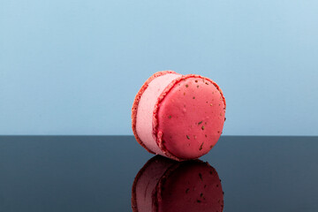 Delicious raspberry ice cream between macarons or macaroons. Selective focus, copy space