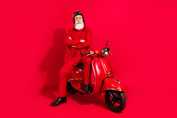 Photo of cute serious age gentleman wear new year costume headwear riding motorcycle arms crossed...