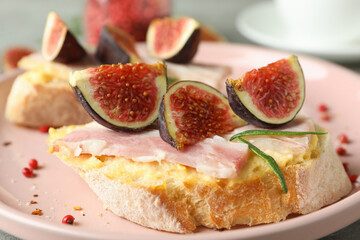 Concept of tasty food with bruschetta with fig, close up