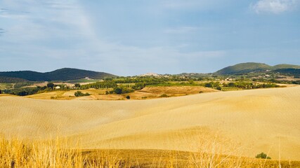 landscape with a field and sky in Tuscany Italy