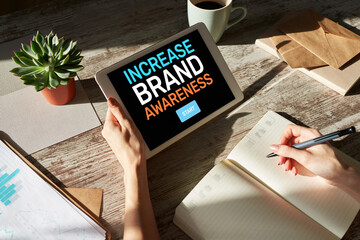 Increase brand awareness text on screen. Advertising and marketing concept.