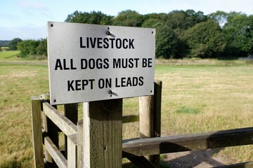 Sign on farmland saying livestock all dogs must be kept on leads