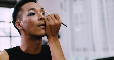 A charming short-haired Asian gay who owns a small beauty salon in the village color the eyelids as...