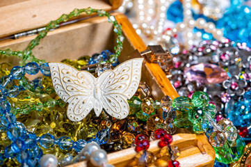 jewelry box, pearl beads and various other multicolored jewelry, soft focus, prosperity concept