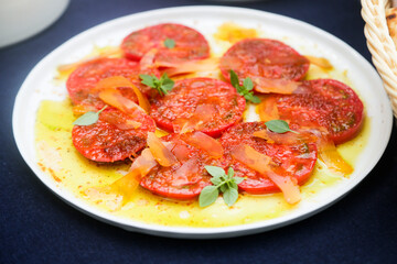 Fresh ripe tomatoes with bottarga