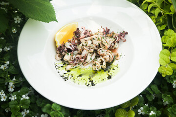 Roasted seafood with lemon and green sauce