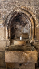 Fototapeta premium English medieval abbey monk's wash basin with bottle of hand sanitiser/sanitizer